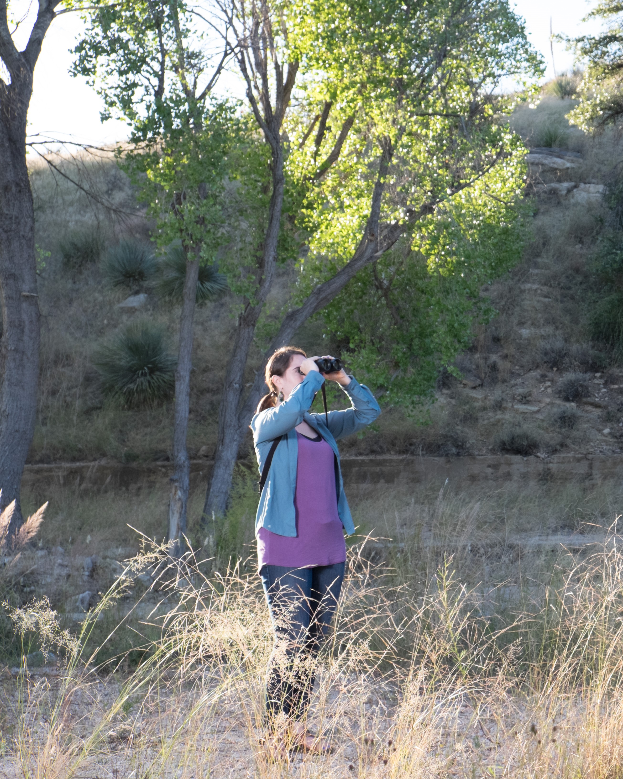 Person looking through binoculars